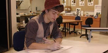 Zeke Tracy works on his drawing project