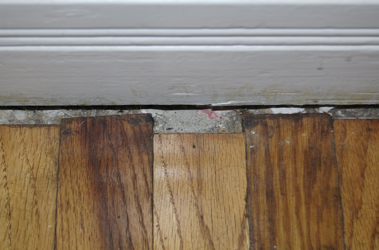 Ugly gaps between floor boards and wall: