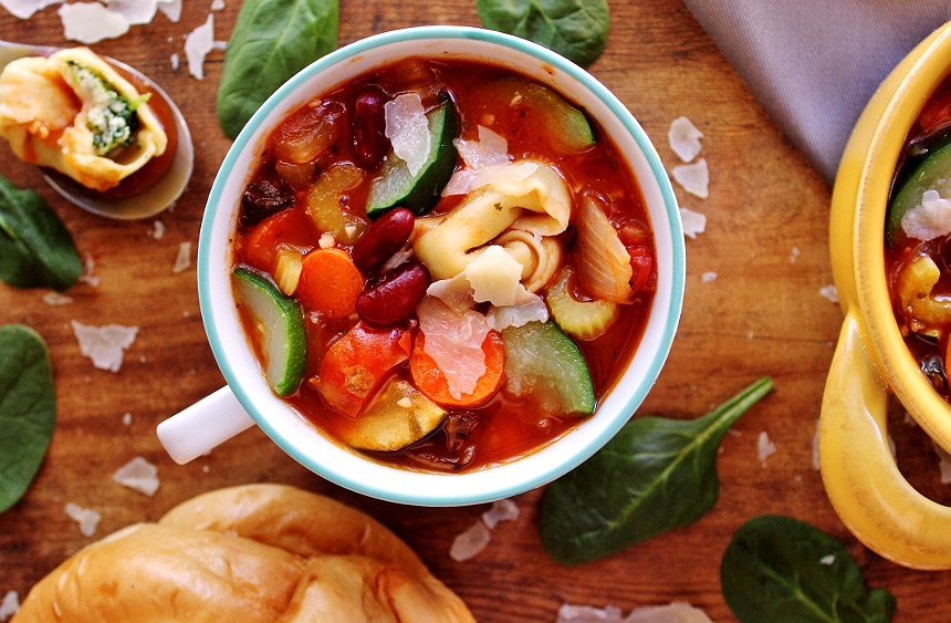 This hearty homemade Tortellini Minestrone features handmade spinach ricotta tortellini and a feast of fresh harvest vegetables sure to comfort in any season.