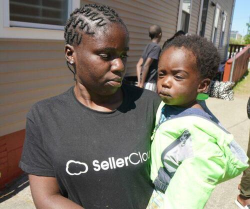 A young Angolan mother and child outside the family shelter in Portland, Maine, on May 25, 2022.