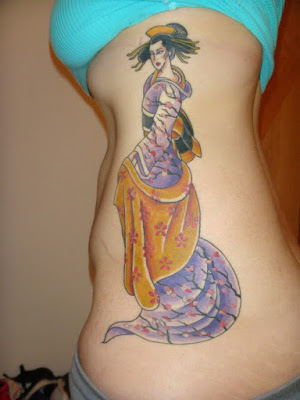 The tattoo can only be seen when the female bends over the body