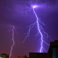 Photo of lightning striking a building taken by takenbytablo from Pexels