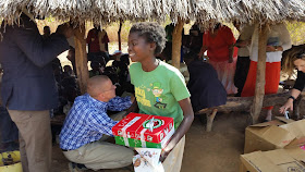 Girl  in Zambia with her Operation Christmas Child shoeboxe.