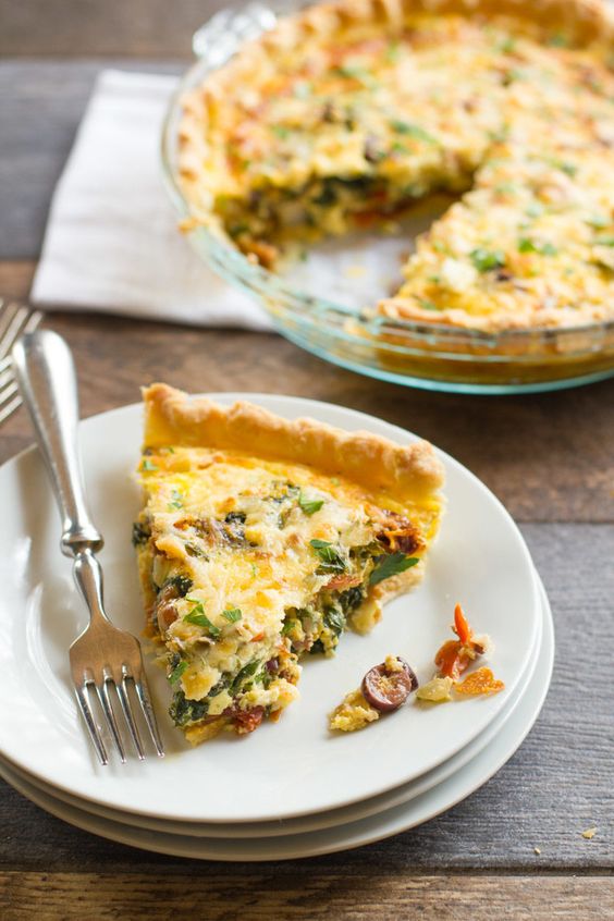 This healthy vegetarian Mediterranean Quiche recipe is packed full of bright flavor and healthy veggies. Serve it for breakfast, brunch, lunch or dinner!