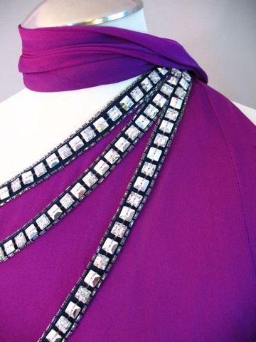 This 1970s disco era evening gown is decorated with rows of square faceted