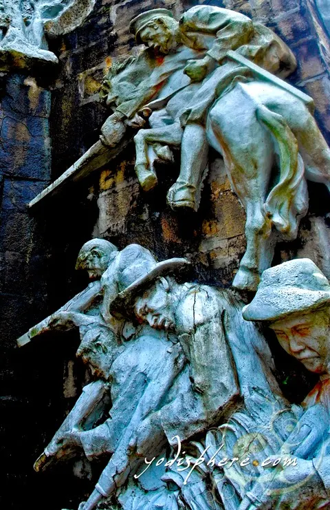 Scultures at the base of the cross in Mt. Samat National Shrine  