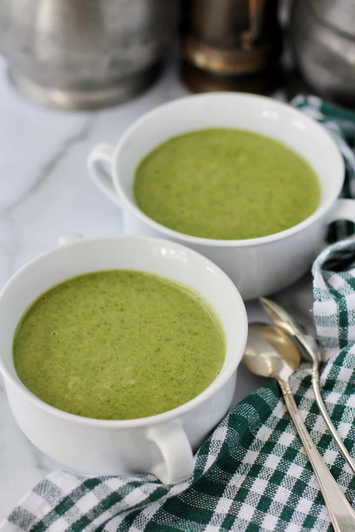 Cream of spinach soup in bowls.