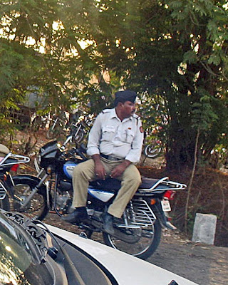 policeman sitting on bike