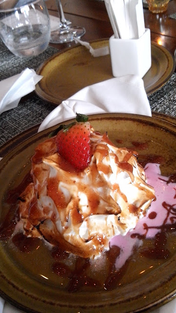 cowrie grill, Baked Alaska Strawberry and vanilla ice cream, sponge cake browned meringue, flambe with brandy