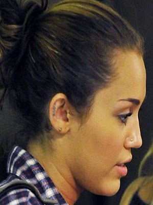 Miley cyrus new ear tattoo design