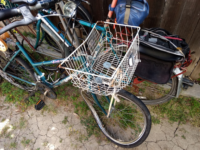 bicycle basket and wheel after car crash