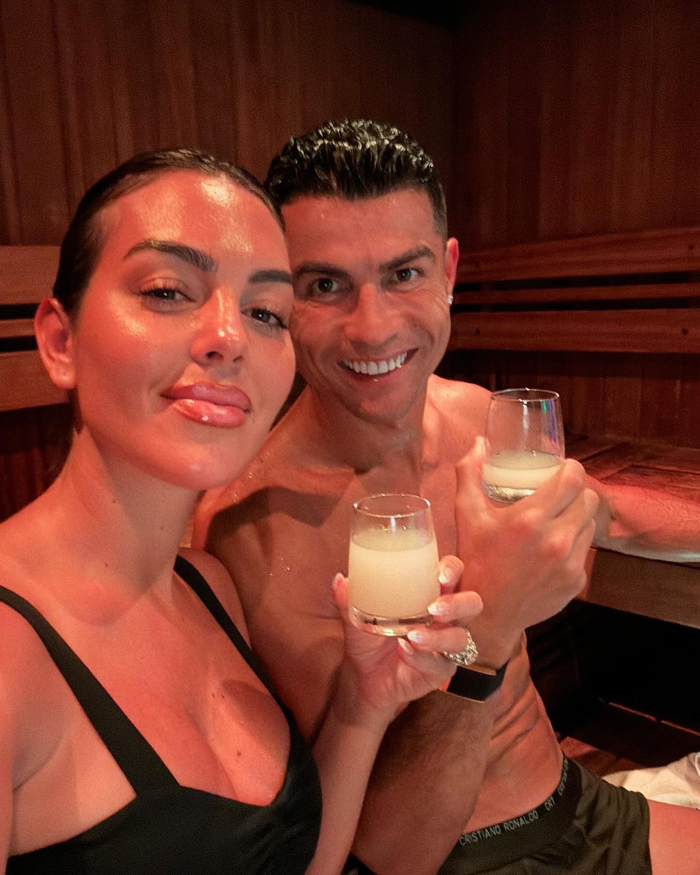 Cristiano Ronaldo takes a shot with his partner, Georgina Rodriguez
