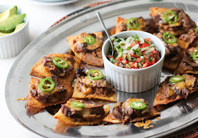 Food Lust People Love: Crunchy fried tortilla triangles topped with refried beans, fajita beef, cheese and jalapeños, these beef fajita nachos compuestos can also be made with store-bought chips. This recipe can also be a main course, as it was for me years ago. You can totally add some shredded lettuce to make you feel better about making this a full meal. 