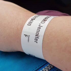 Hospital wristband on female wrist