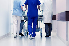 Nurses walking through hospital hallway