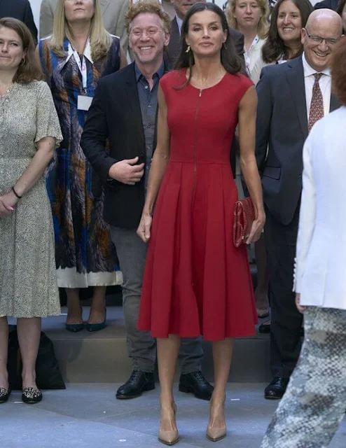 Queen Letizia wore a red fit-and-flare zip-front dress by Carolina Herrera. The Queen is wearing Jose Luis Joyerias gold earrings