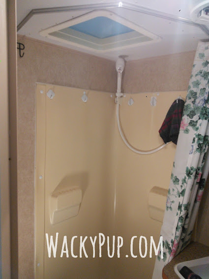 Free and Easy Fix for a Tiny Shower - Amazing! A ton of great ideas for organizing and remodeling campers and small spaces!