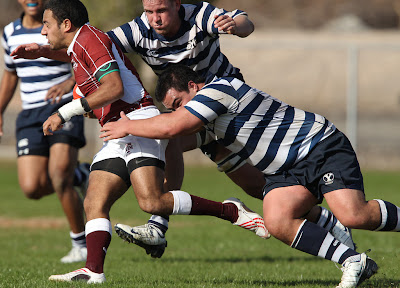 BYU Rugby Big Boys, Prop Ray Forrester and Lock Mark Bonham, swarm an overly optimistic Texas A&M player