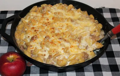 Skillet of apple and pork macaroni and cheese.