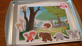 Magnetic animals and matching scene on baking sheet