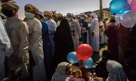 Eid Prayer on 14 May 2021, foreign students wearing masks before heading to pray Eid prayer at Al Azhar Mosque "AFP"