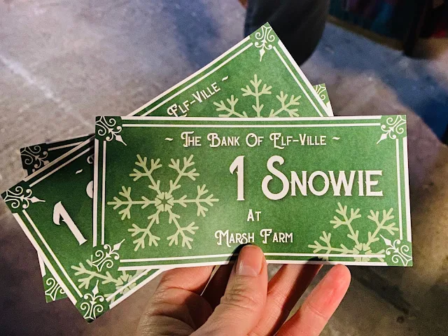 3 snowies which are sheets of paper saying "the bank of elf-ville 1 snowie at Marsh Farm"