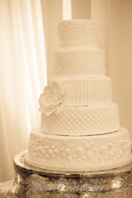 Silver cake stand is part of the inventory at Elizabeth Bailey Weddings