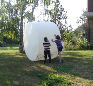 Kids pushing water tank