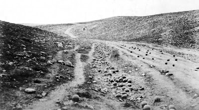 Roger Fenton's iconic 1855 photo of the 'Valley of the Shadow of Death' Crimea with canon balls placed on the road.