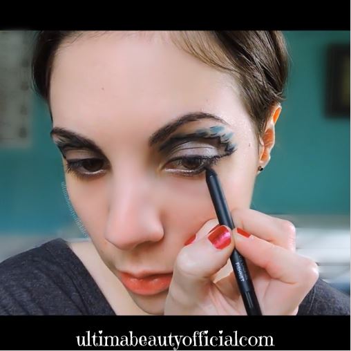 Ultima Beauty using an eyeliner pencil to line lash line
