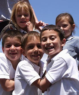 Kids smiling in a group photo