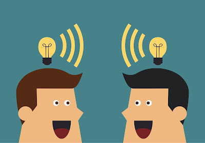 2 cartoon businessmen sharing ideas with light bulbs over their heads