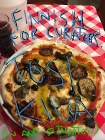 image of a pizza with text overlay: Finnish for curators: tosi kiva (in any situation)