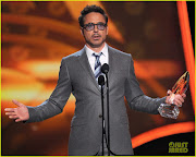 Robert Downey Jr. shows off his award at the 2013 People's Choice Awards . (robert downey jr peoples choice )