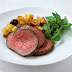 Glazed fillet of beef roasted with potatoes and olives