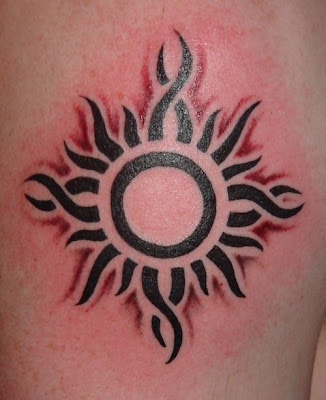 Picture of flaming tribal sun tattoo design.