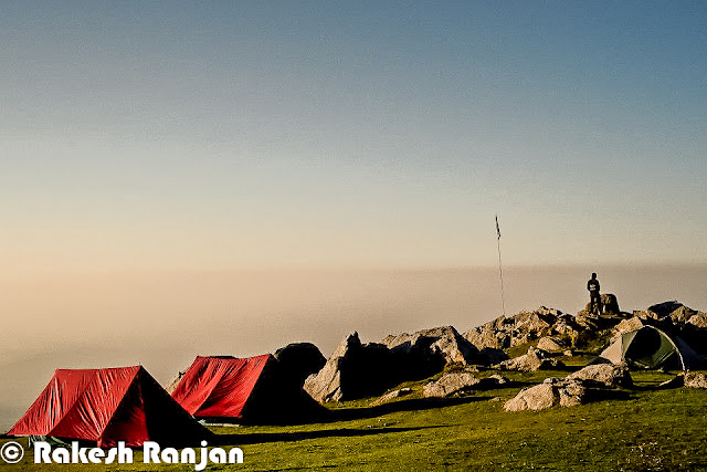 Triund is one of the popular treks in Himachal Pradesh. This is counted in moderate treks, although many of the trekkers consider it simple trek. This Photo Journey shares wonderful series of photographs by Rakesh Ranjan, who has done this trek many times. Let's check out this Photo Journey and enjoy the trek with Rakesh Ranjan !Triund is just 10 kilometers from Bhagsu Nag which is now very famous among  foreigner tourist as a trekking paradise. Triund is name of a ridge in Dhauladhar Himalayas... Reaching Triund is very easy for people coming to Mcledoganj and Dharmshala. Accommodation at Triund is available in the rest house of Forest Department, but water has to be fetched from a distance of about 2 kilometers. Most of the times trekkers prefer to stay in tents. Many local companies arrange trekking facilities for trekkers & tourists. Although many of the trekkers take their stuff with them.  Triund lies at the feet of the perpetually snow covered Dhauladhar mountain ranges at the height of three thousands meters. It's around 20 kilometers from Dharmshala Town. The snow line starts at Ilaqa which is at 3300 feet, 5km from Triund.A photograph showing sunset moments from top at Triund !Triund is a popular picnic and trekking spot around Dharmshala/Mcleodganj. The tracks from Rawa, Dal Lake, Dharamkot and Bhagsunag meet at a ridge known as Galu temple (2130 meters) which has a small shrine and water point.A wonderful photograph by Rakesh Ranjan which looks quite similar to what we have seen in Windows-XP wallpapersHimalayas is very beautiful but my main emphasis to come in this area can be Yoga & Meditation...The trek to Triund is quite easy as compared to other treks and first timers can manage doing this trek. Some of the trekkers also like to move ahead to Ilaka, as path is a little treacherous in some spots can be more adventurous.A herd of Sheeps around Triund Trek !A View of Mcleodganj & Dharmshala towns from triund Trek in Himachal Pradesh !Folks who plan to visit Mcledoganj/Dharmshala during the weekend, they plan to go till Triund during day time and come back by evening. This trek can easily be done in one day, although it can be completely different experience to stay there in tents.Triund is on the foothills of Dhauladhar mountain range. The entire trek is full of adventurous experiences. The Triund trek is one of the most popular treks in the hills of Himachal Pradesh, INDIA. It makes for a very pleasant and enjoyable Trekking experience in the state. It is a short trek on the oldest migratory route followed by shepherds of Chamba and Kangra regions of Himalayan State in India.The Triund Trek combines the beauty of two of the most beautiful valleys in the Himachal Pradesh. The views from Laka are breathtaking and you occasionally come across shepherds rearing their flock of sheep in the green pastures. This trek is quite easy and pleasant.The Dhauladhar range is a southern branch of the main Outer Himalayan chain of mountains. The famous Gallu Temple is near the Mcleodganj waterfall in Dharamsala.On the way to Trek, folks can enjoy various flowers & herbs.Big Thanks to Rakesh Ranjan for sharing this wonderful Photo Journey from triund. PHOTO JOURNEY already has some wonderful journeys from neighboring places like Dharmshala, Mcleodganj, Palampur, Baijnath & many other interesting towns/sights. 