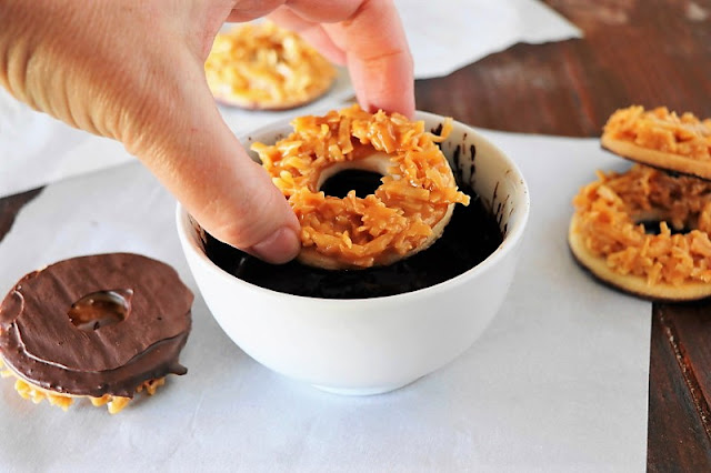 Dunking Homemade Samoas Cookies in Chocolate Image