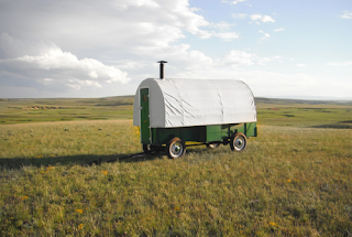 image: photo of a restored vintage sheep wagon