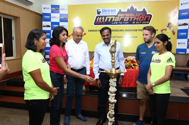 (L to R) Ms. Nisha Millet, Indian Olympic Swimmer, Ms. Reeth Abraham, Brand Ambassador - SPBM, International athlete and Arjuna Awardee, Mr. Nagaraj Adiga, Race Director, Mr. M Murali, Managing Director, Shriram Properties, Mr. Tom Naylor, Technical Race Director, Brighton Marathon, UK and Ms. Sudha Singh, Indian Olympic Runner lighting the lamp at the Press Conference.