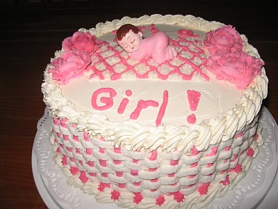 Baby shower cake with note of the baby sex on top of its surface