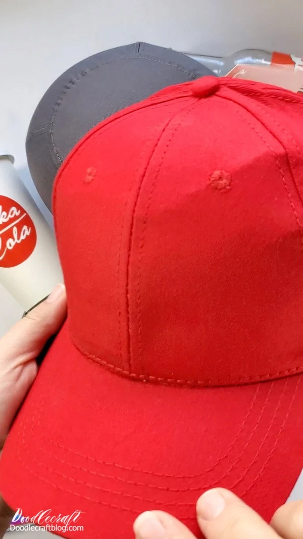 red hat ready to have the Nuka-Cola logo applied to it with the cap heat press