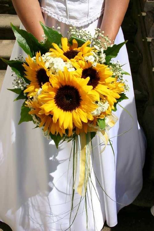 Sunflowers white flowers red berries and ivy leaves bridal bouquet