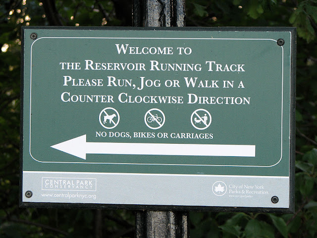 Sign on the jogging track around the Jacqueline Kennedy Onassis Reservoir, Central Park, New York