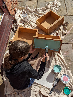 Daughter painting furniture