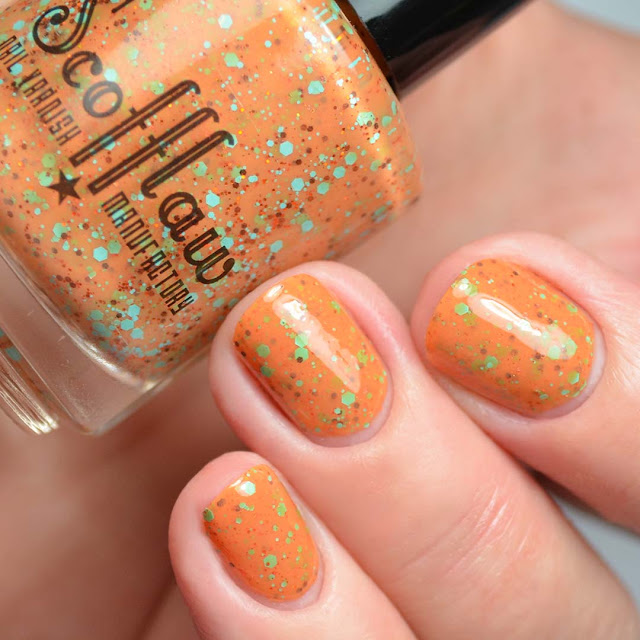 orange nail polish with colorful glitter three finger swatch
