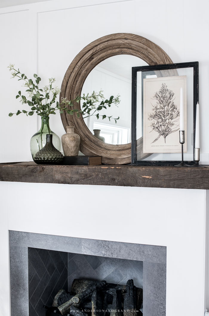 Mantel filled with vases and decor