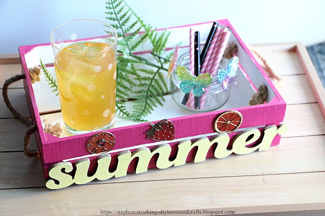Painted wooden serving tray with bright yellow summer sign with decorations on tray