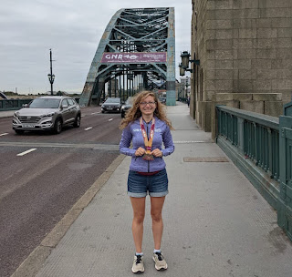 Me in my GNR hoodie wearing my medal while on the Tyne Bridge.