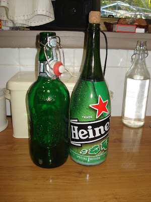 Two green bottles for recycling